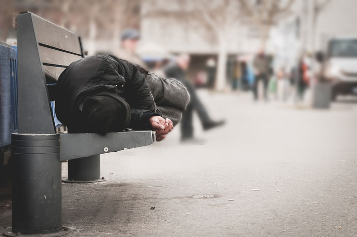 homeless on street bench