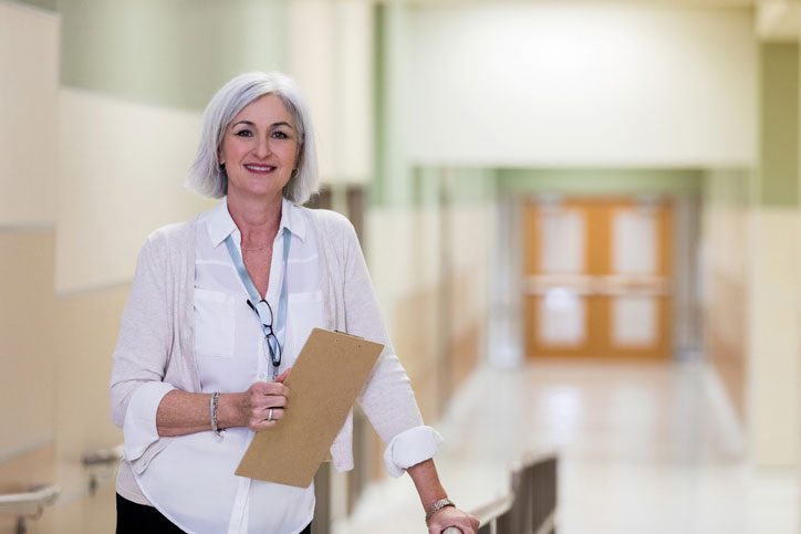 older social worker in hallway