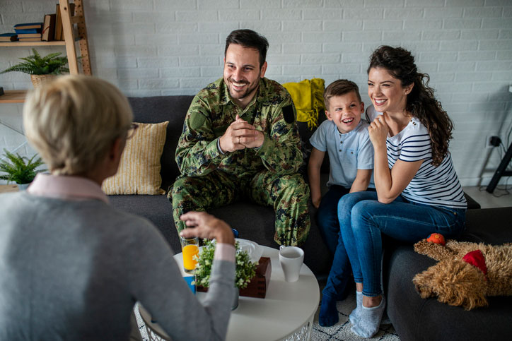 military family talking with social worker