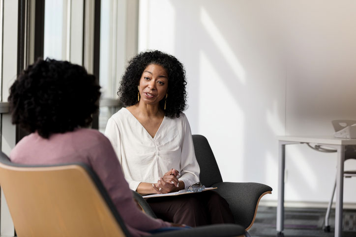 female counselor talking with woman