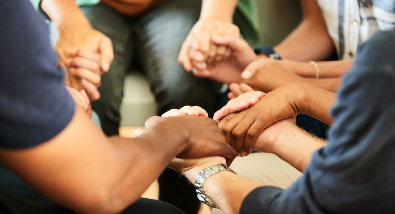 holding hands in support of one another